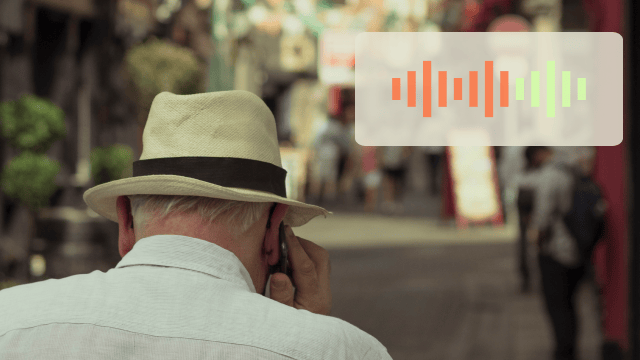 Man takes phone call on park bench