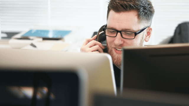 Employee answers call at contact center