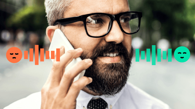 Man takes phone call on park bench