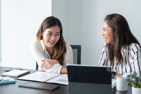 A young accountant is in a business meeting with their new client.