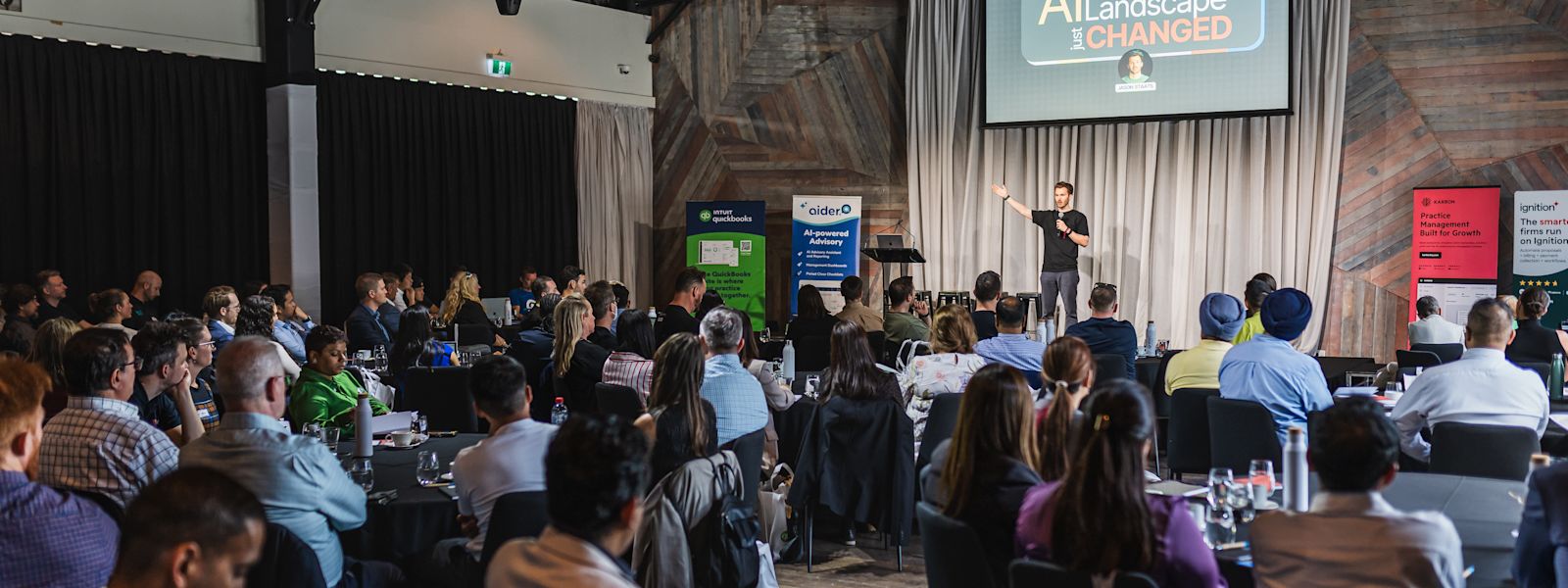 Jason Staats presents on "AI: Why the US (and Global) landscape just changed" to a room full of accounting professionals at the AI in Accounting Summit 2025