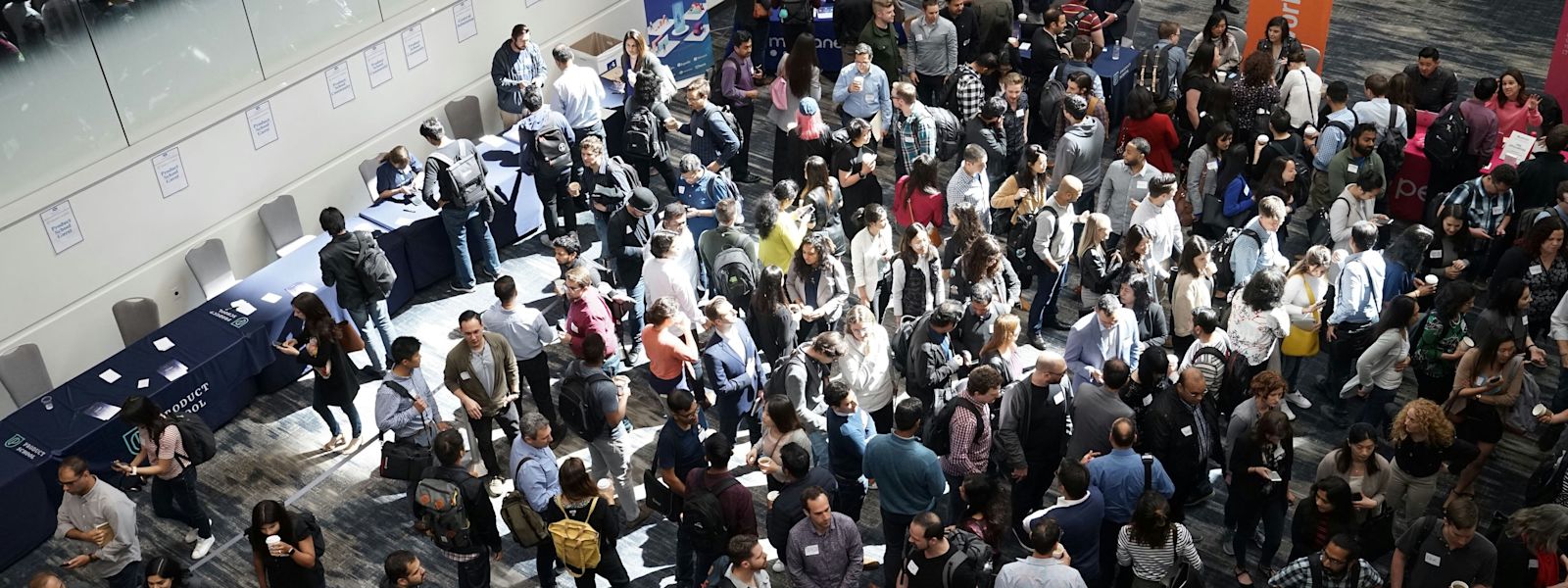 Accounting professionals gather in a dynamic live event setting, engaging in conversations and exchanging ideas, highlighting the importance of in-person networking for career advancement.