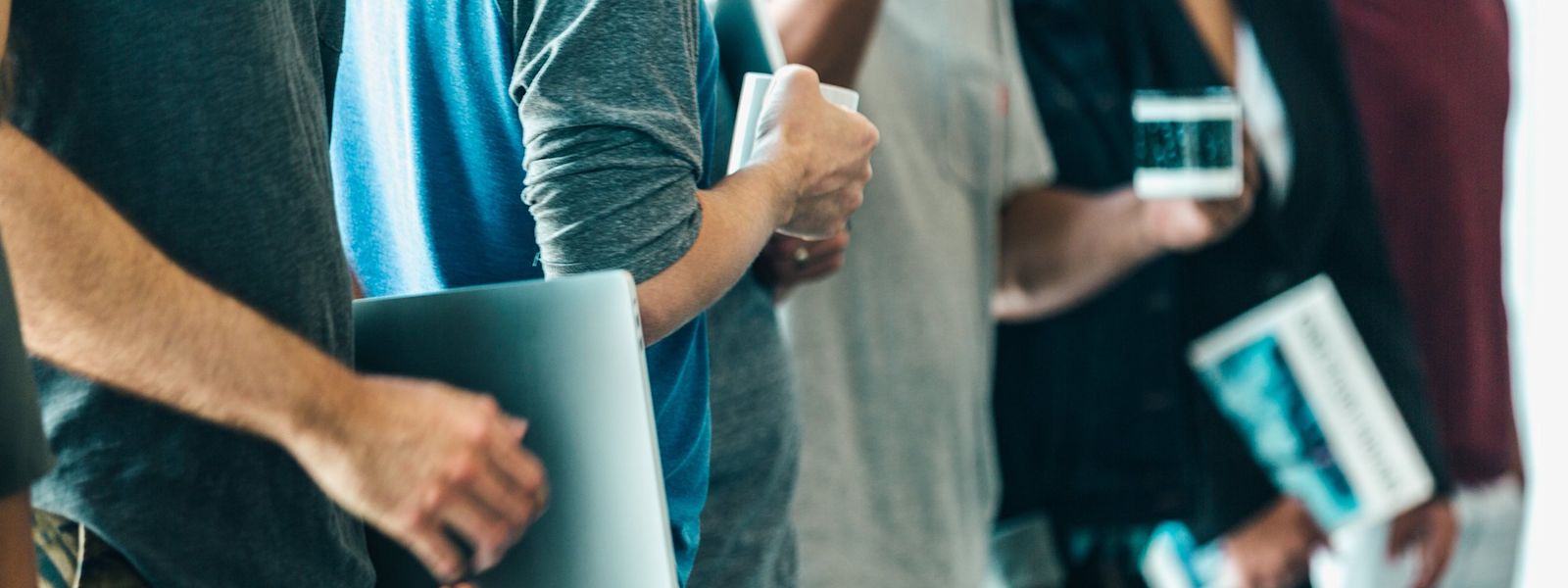 A line of young adults standing at work