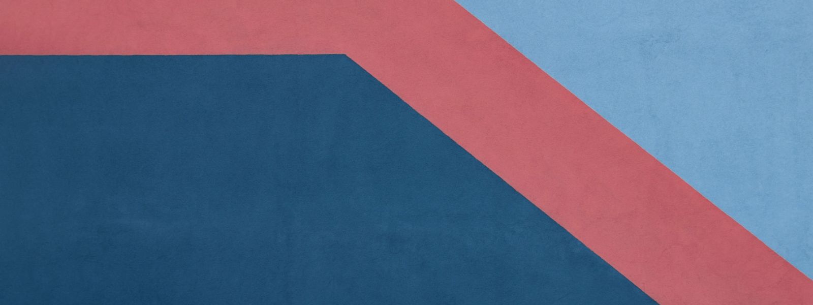 A painted wall with a think salmon-colored line trending down.