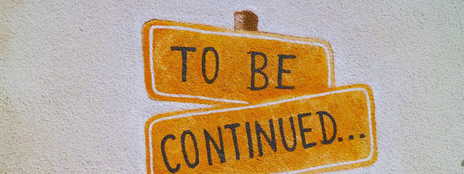 A drawn signpost that reads "to be continued..."
