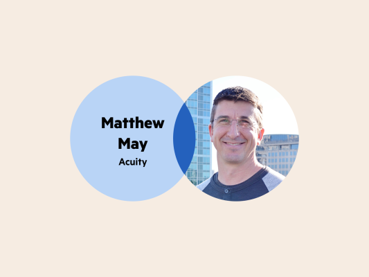 A Venn diagram. The left circle is blue with the words Matthew May Acuity. The right circle is Matthew's headshot. He is wearing thin-rimmed glasses, has short-cropped hair and his background is a city scape.