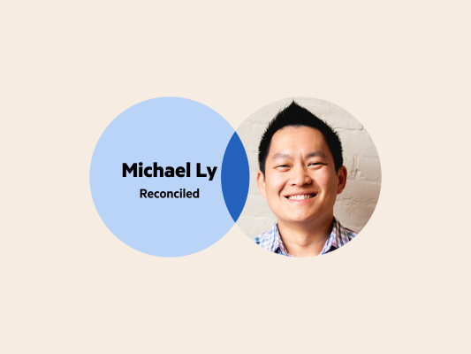 A Venn diagram: the left circle is pale blue with the words 'Michael Ly, Reconciled', and the right circle is Michael Ly's headshot.