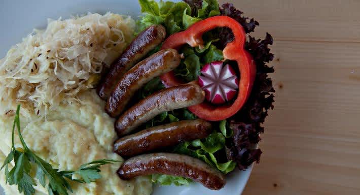 A plate of traditional wurst and sauerkraut from Stein's in London