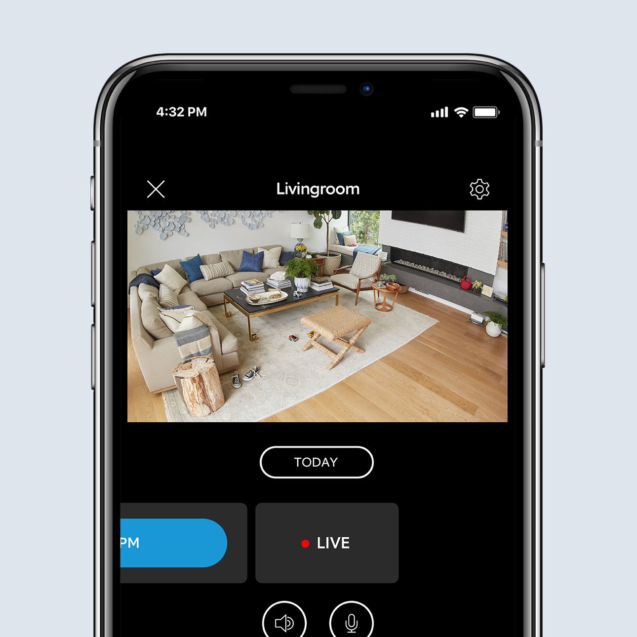 Smartphone displays live HD video feed of lounge in the Ring app, showing furniture and toys in real time.