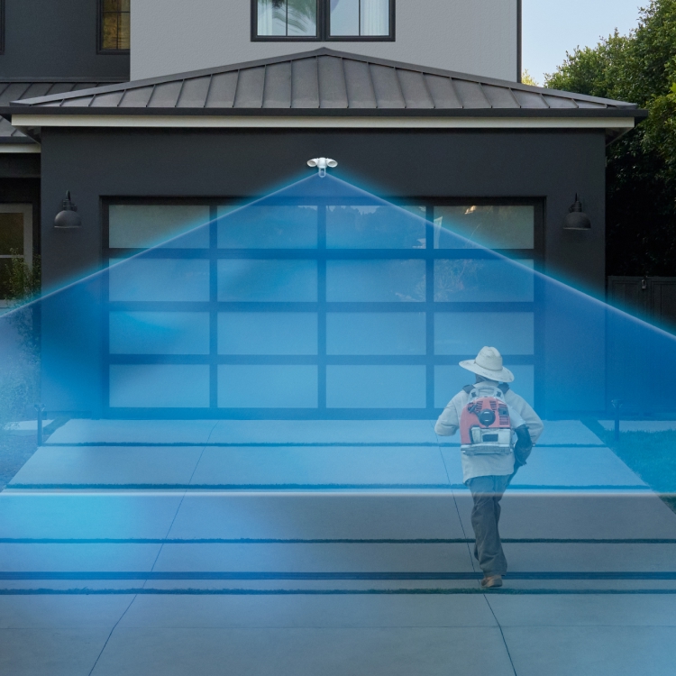 Floodlight Cam Pro (2nd Gen)'s radar-powered precision technology is shown detecting a landscaper walking up a driveway