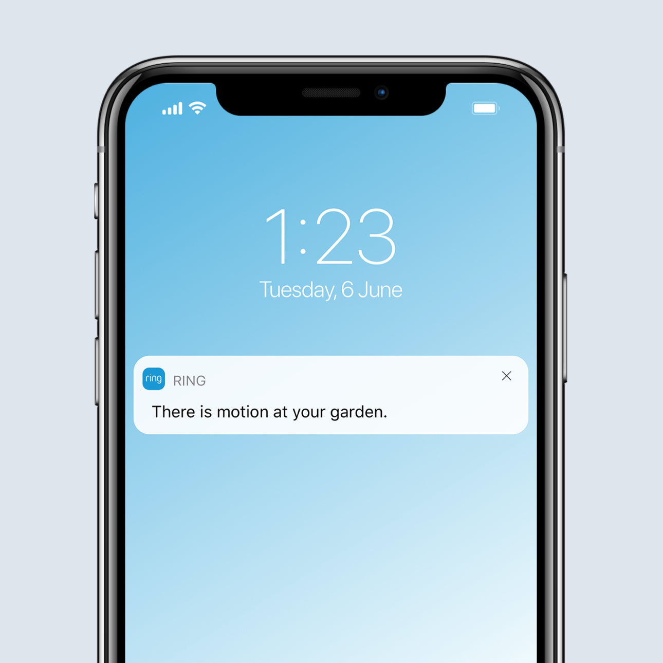 Smartphone screen showing a Real-Time Notification alert in Ring app for detected motion in the garden.