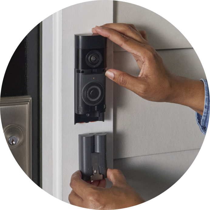 Close-up of a person removing the Quick Release Battery Pack from the Battery Video Doorbell Plus