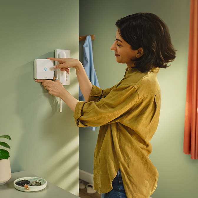 A girl installing a Ring Intercom Audio.