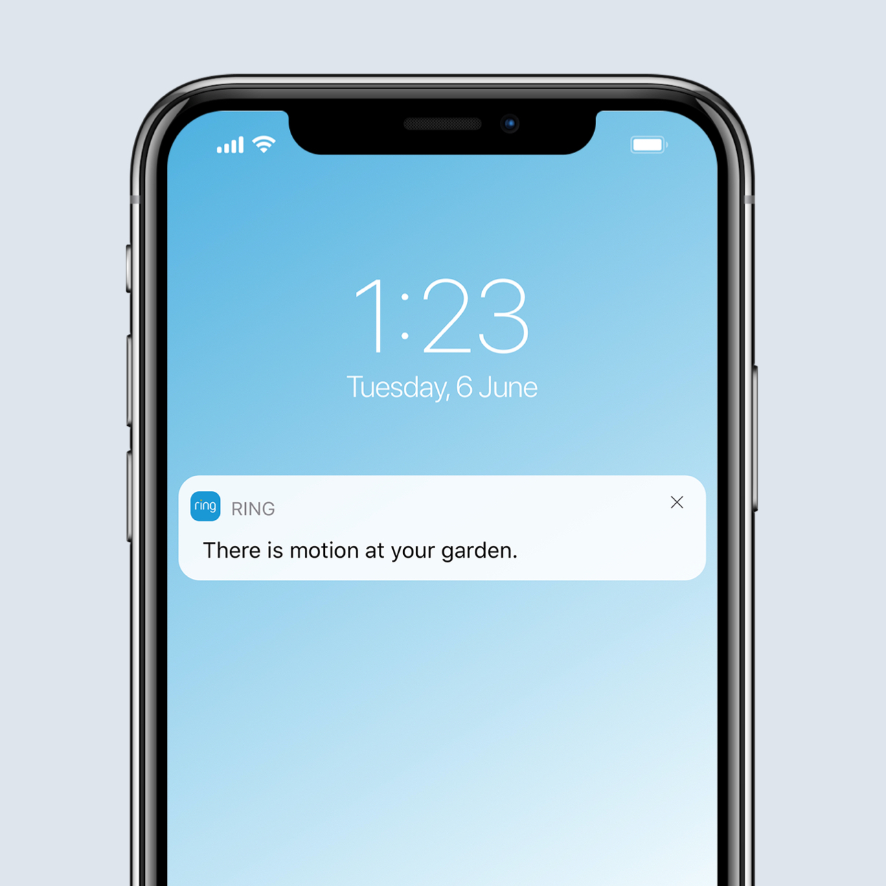 Smartphone screen showing a Real-Time Notification in Ring app for detected motion in garden.