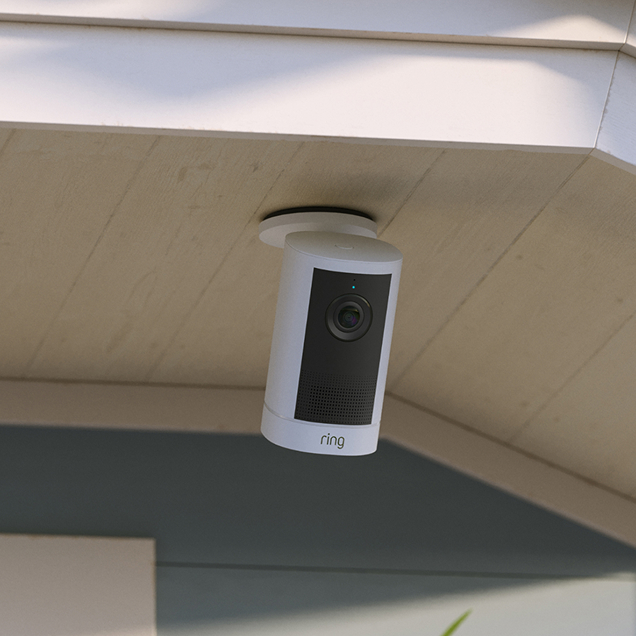 Ring Outdoor Camera 4K Plus mounted flush to a drop ceiling, lens facing downward for wide-angle coverage.