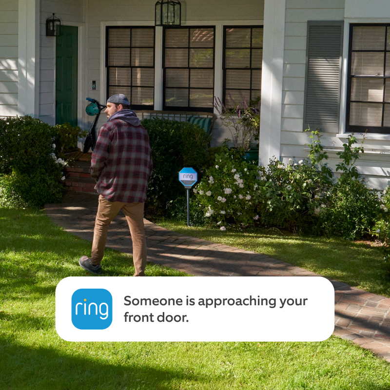 A man walking up the path, leading to the front door of a house. Text on visual reads 