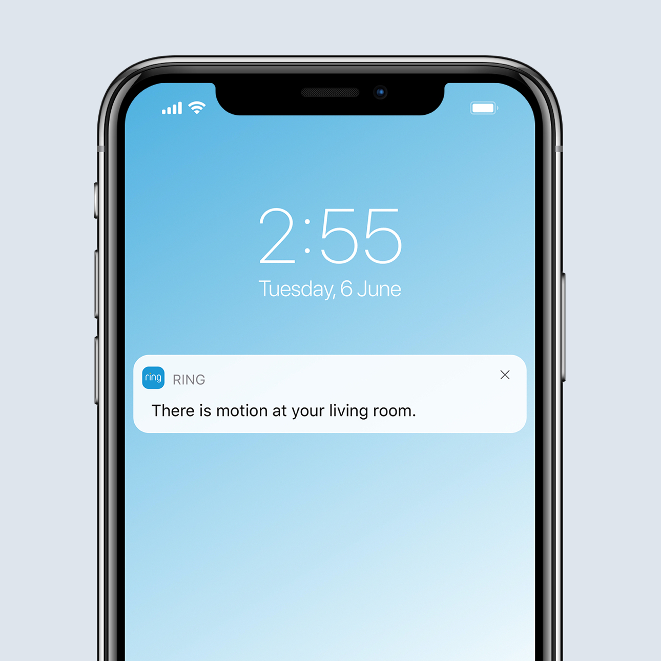Smartphone screen displays Ring app alert with motion detected in the living room at 2:55 on Tuesday, 6 June.