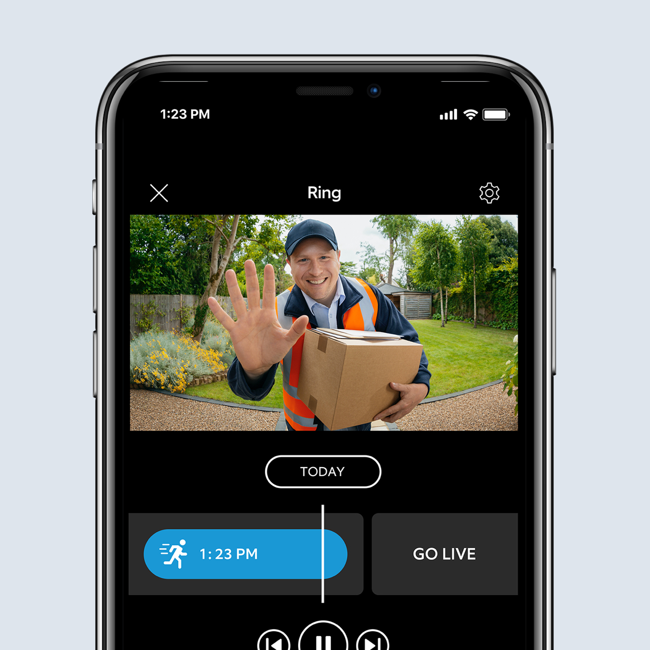 Smartphone displaying a live Ring app video of a delivery driver with a parcel waving at the front door.