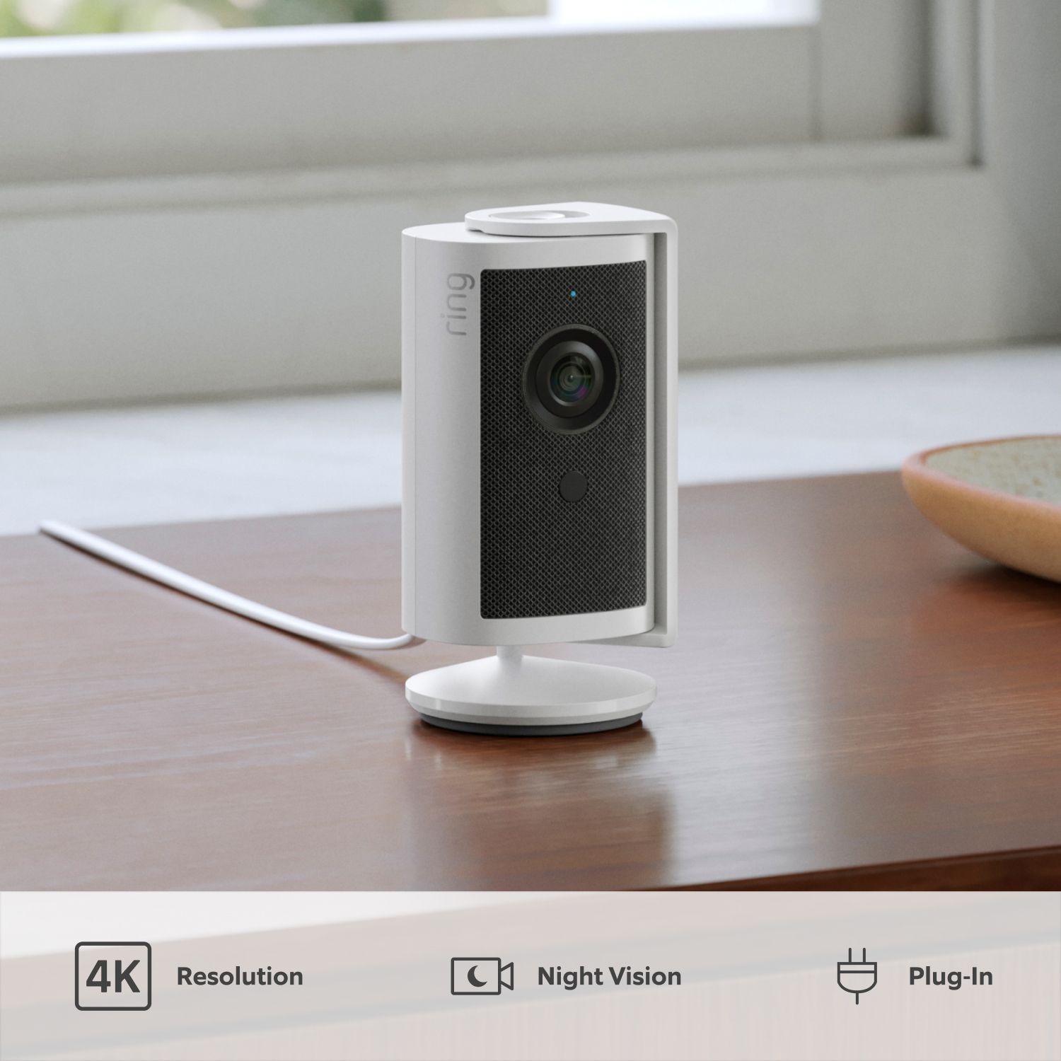 Indoor Camera 4K - Plug-in:White Indoor Camera 4K on a wooden table, highlighting 4K resolution, night vision, and plug-in power.