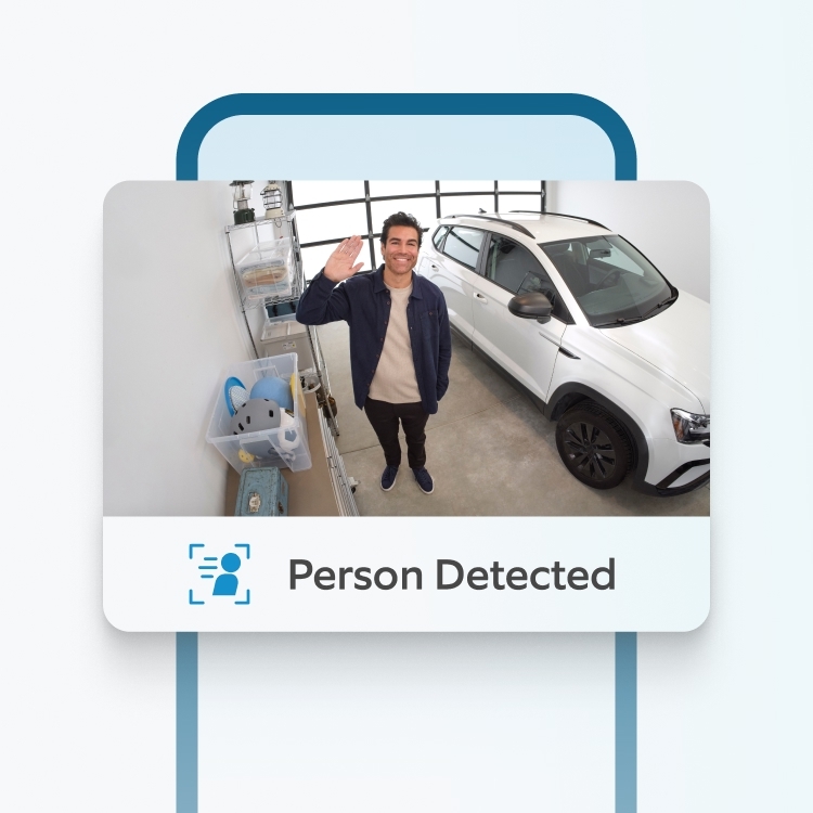 Ring Indoor Camera detects waving man in garage beside car, as Ring app displays real-time 