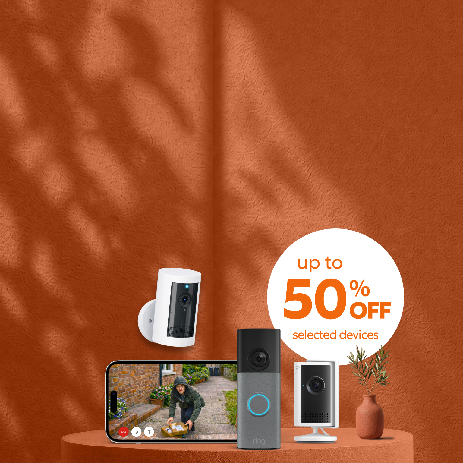Image with orange background with the three Ring devices. 