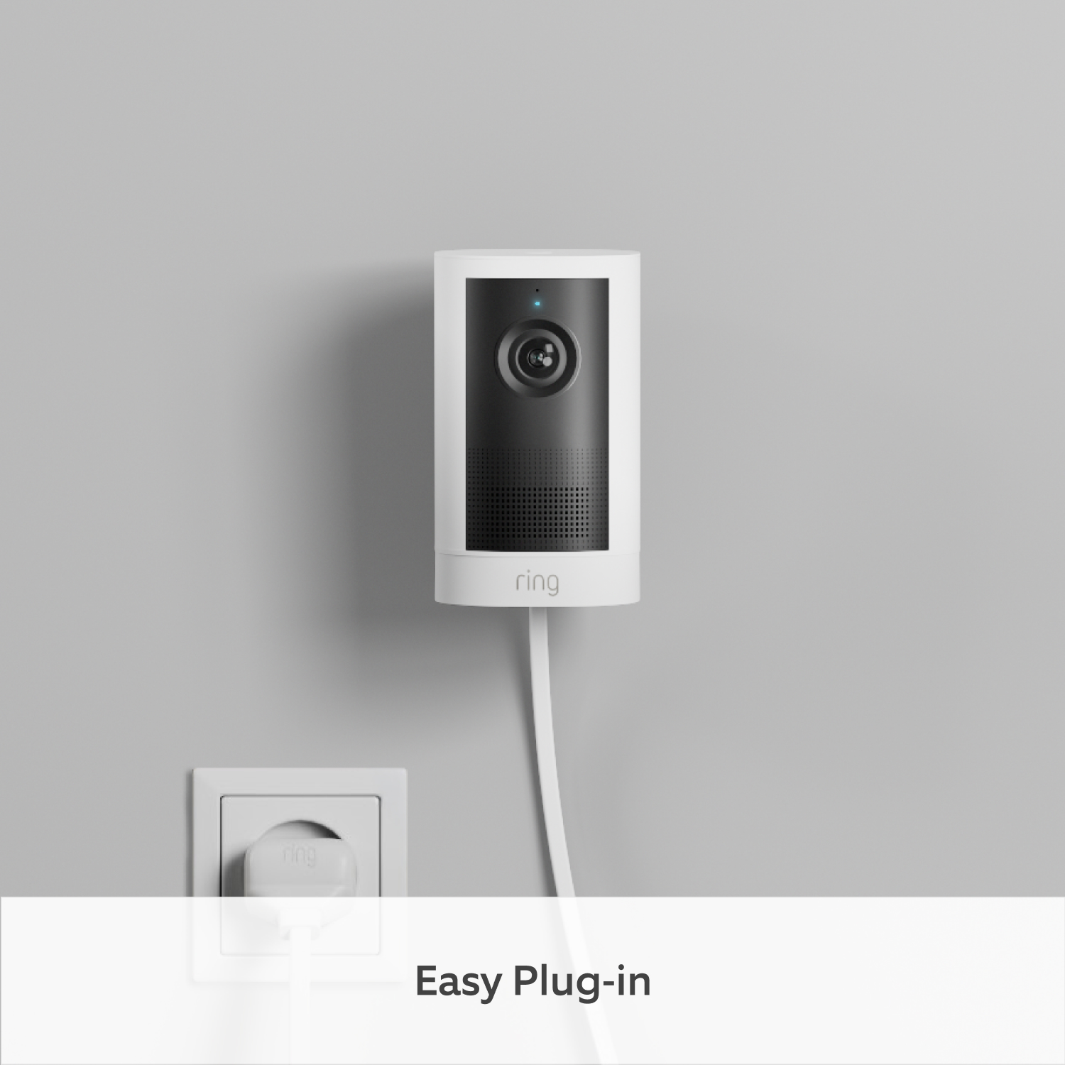 Outdoor Camera 4K Plus  - Plug-In:White Ring Outdoor Camera 4K Plus camera mounted on wall with plug in plug socket, demonstrating easy installation