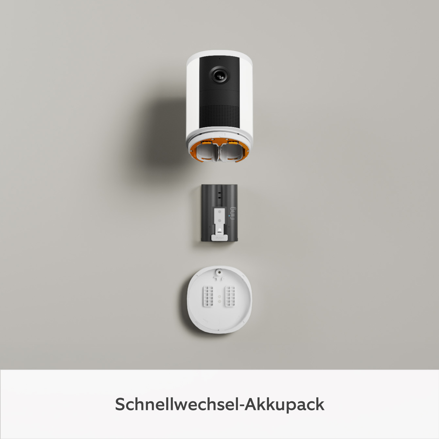 2er-Set Spotlight Kamera Akku (neueste Generation) (for Spotlight Cam) - Die Spotlight Cam (2. Gen.) liegt auf einer ebenen Fläche, wobei das Akkufach geöffnet und der Schnellwechsel-Akkupack entfernt wurde.