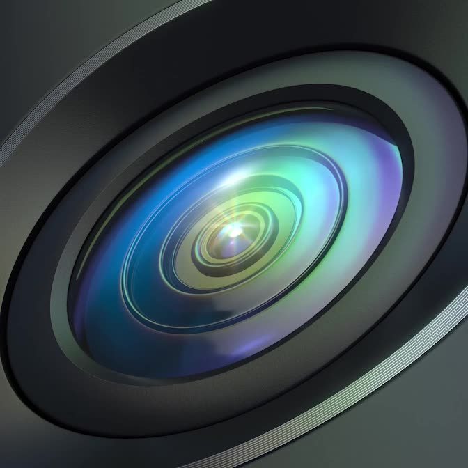 A close-up of a Ring camera lens shows the complexity of the technology inside.