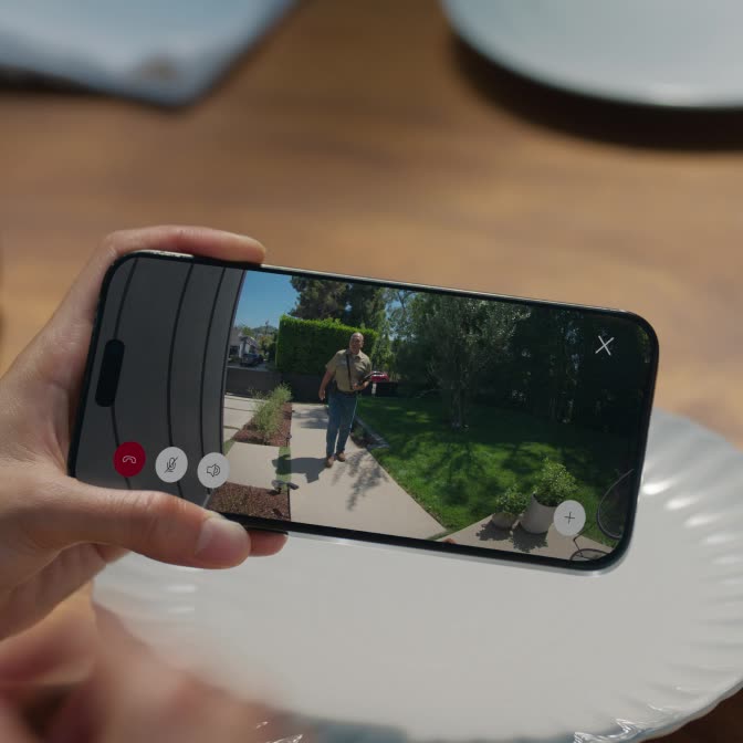 Close-up of someone holding a smartphone that shows a Department of Water and Power identification badge.