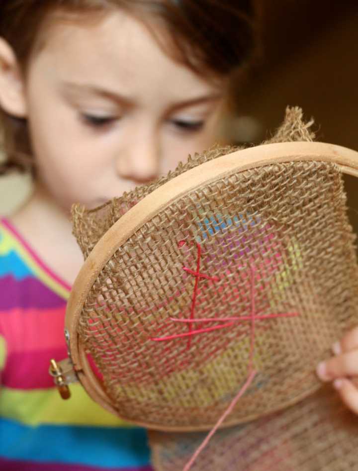 Kid-adding-embroidery-to-a-treasure-bag-Crafting-Connections