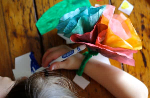 Wearing-our-Paper-Flower-Wristlet-while-Coloring-600x391