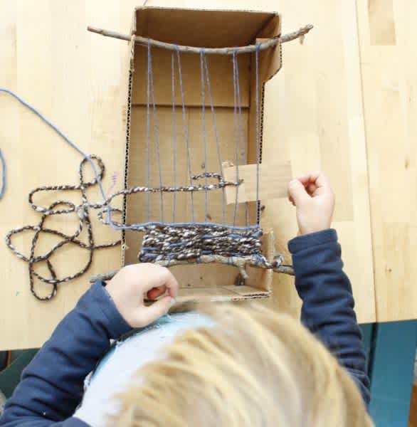 Weaving-on-a-Cardboard-Box-Loom-586x600