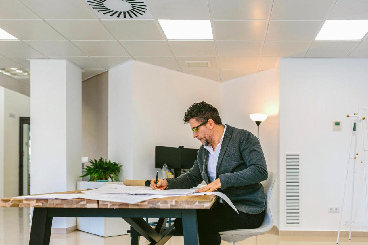 Letting agent or landlord sat at desk