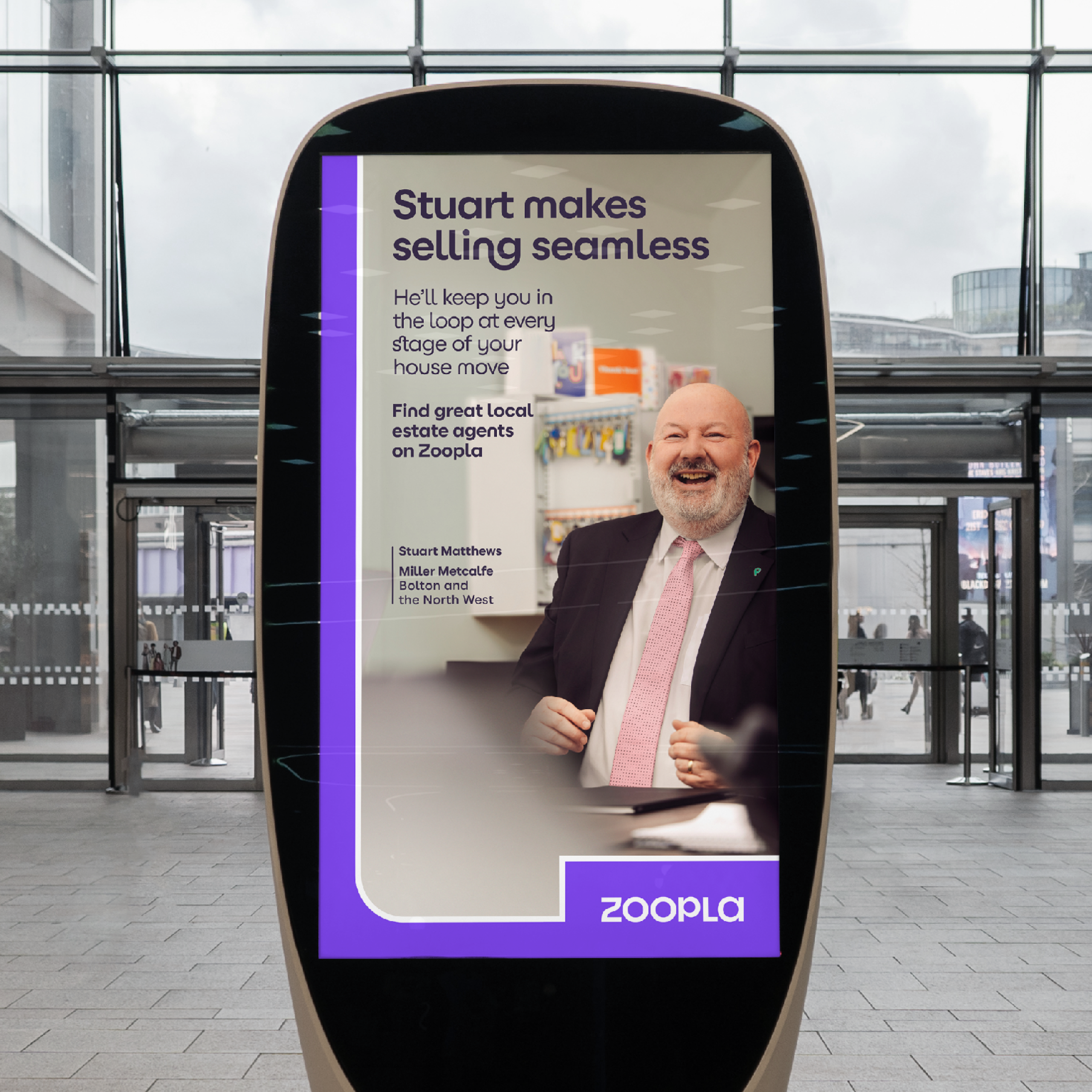 Agent Stuart Matthews from Miller Metcalfe on billboard.