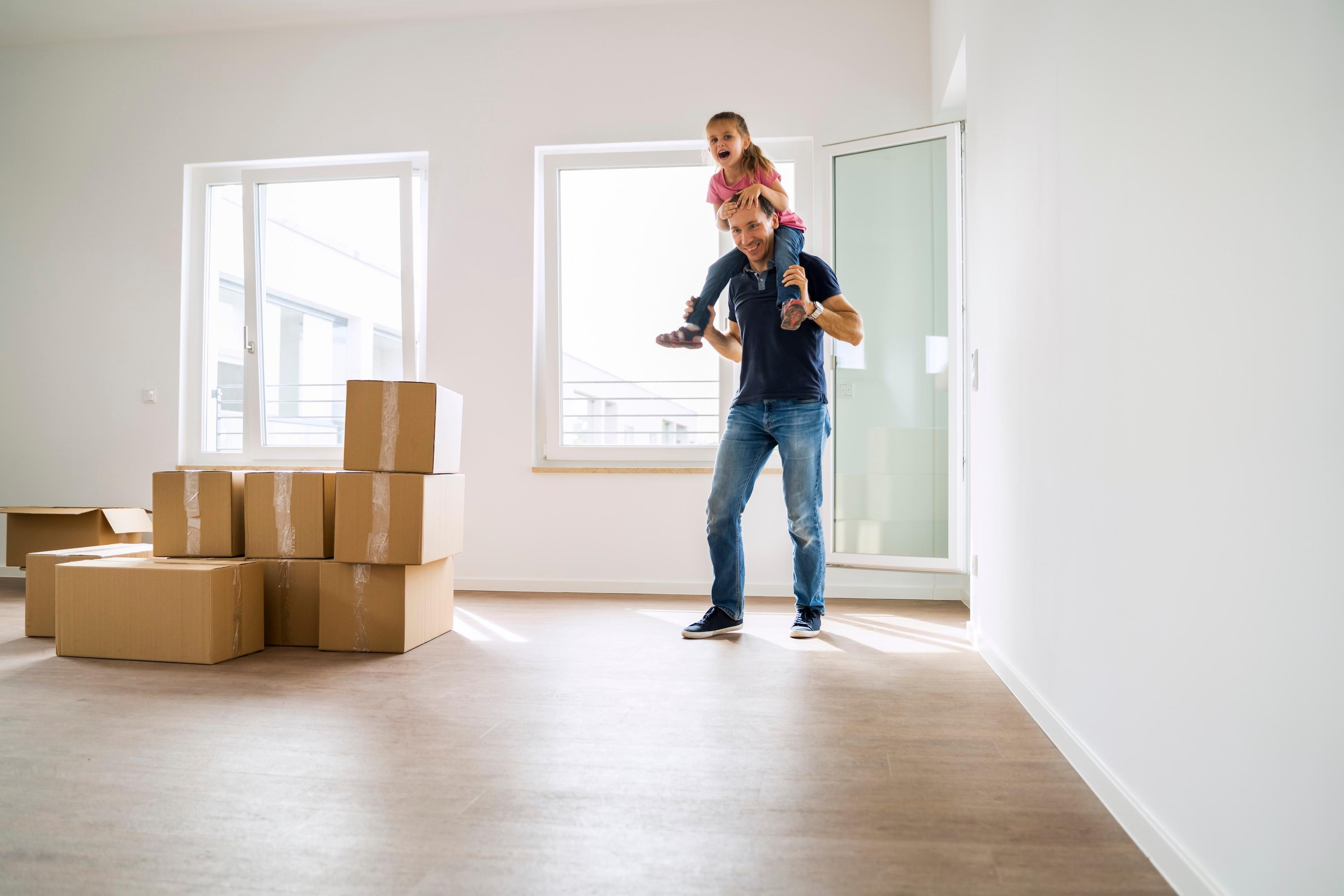 A father and daughter moving into a new build flat