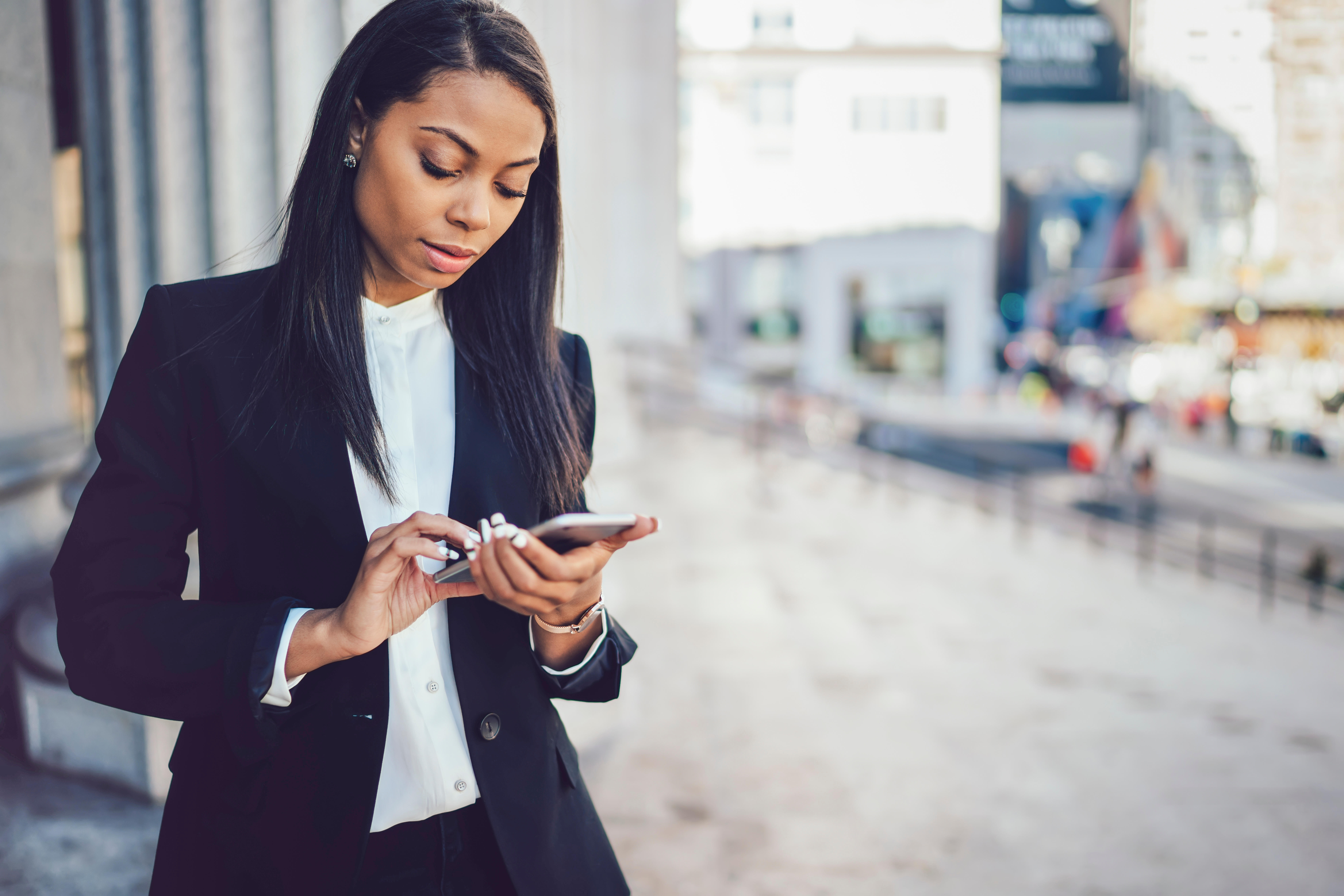 Agent in smart wear holding phone