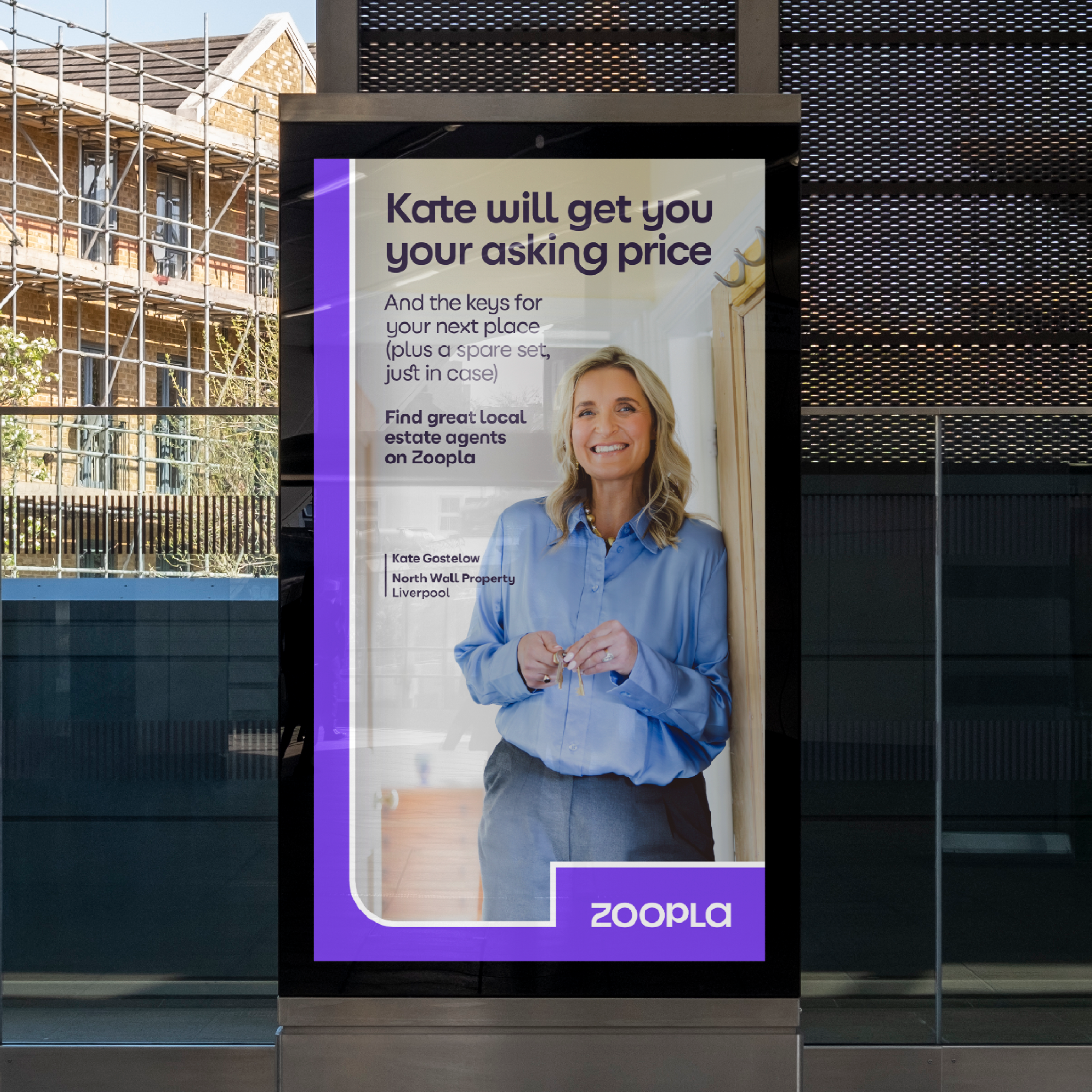 Agent Kate Gostelow from North Wall Property on billboard.