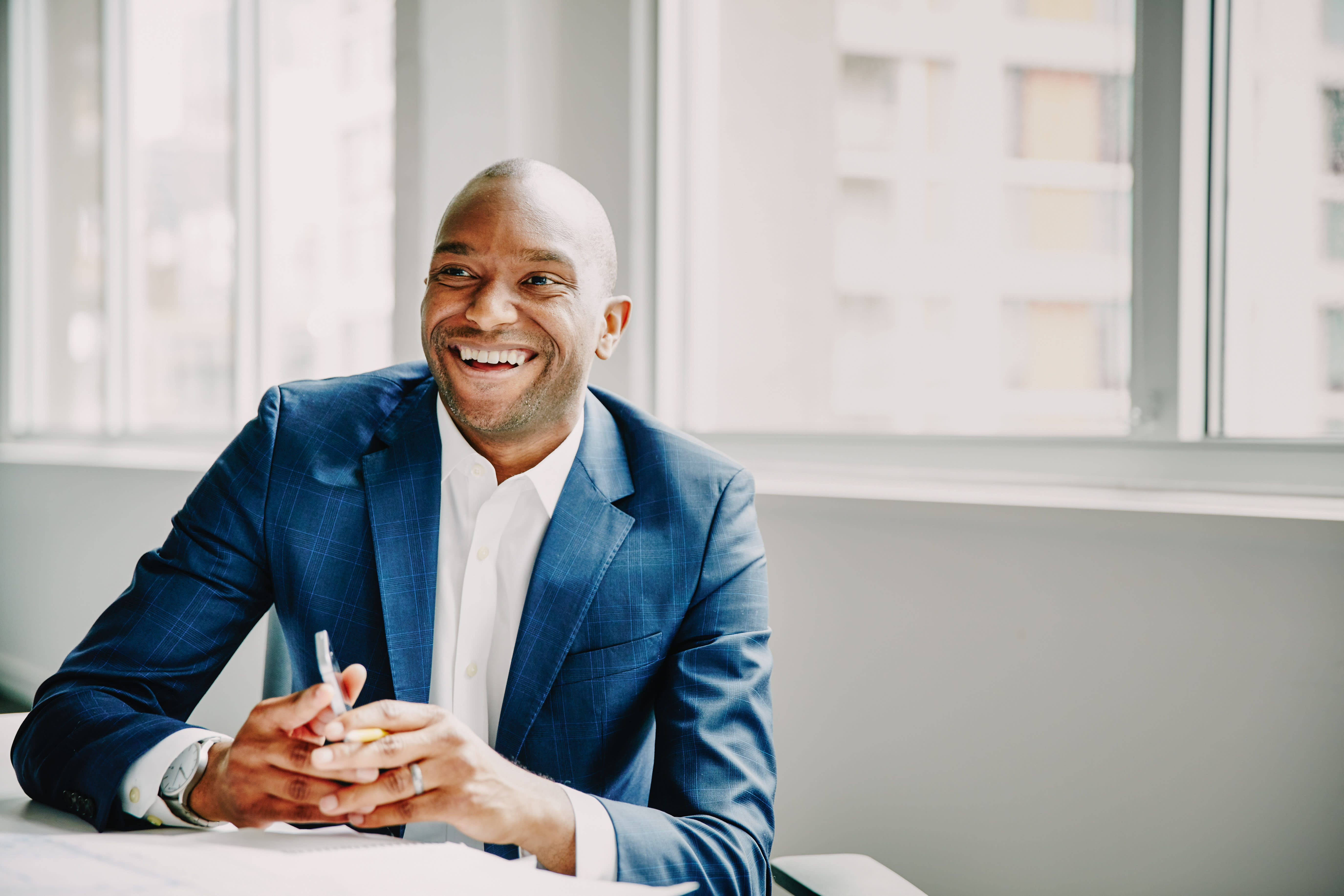 Agent in suit smiling