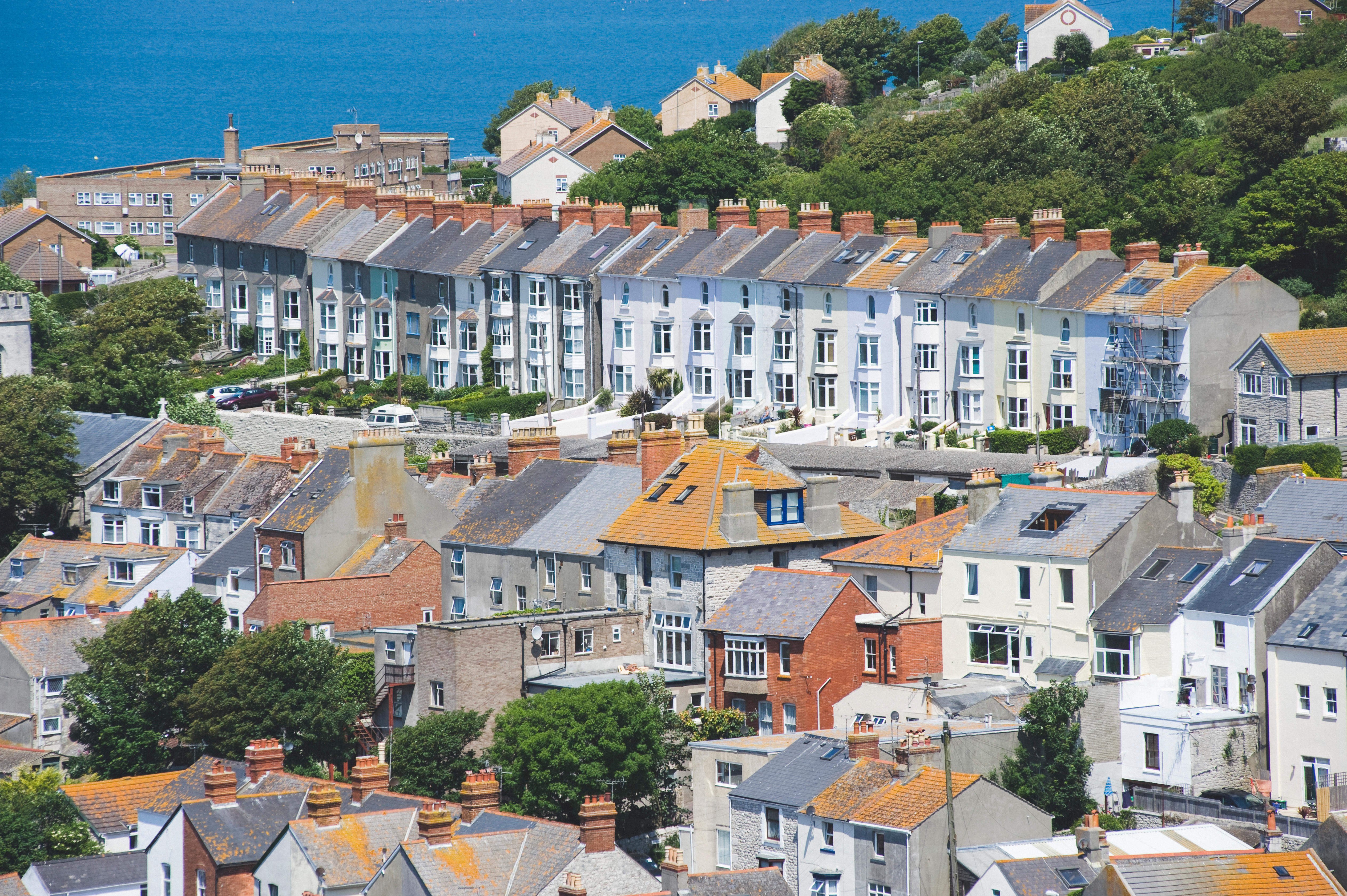 Rows of terraced houses on a hill by the coast