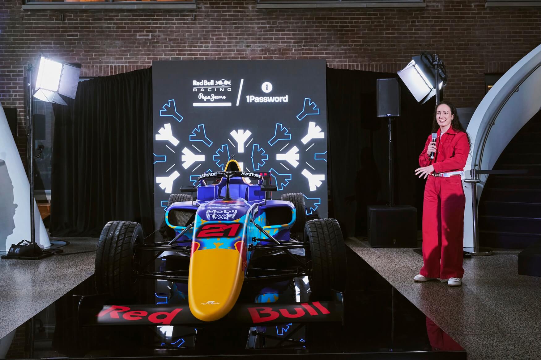 A photo of Alisha Palmowski speaking to the crowd after unveiling the livery design.