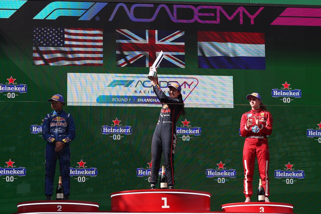 A photo of Alisha Palmowski on the podium after winning in Shanghi, the first race of 2025.