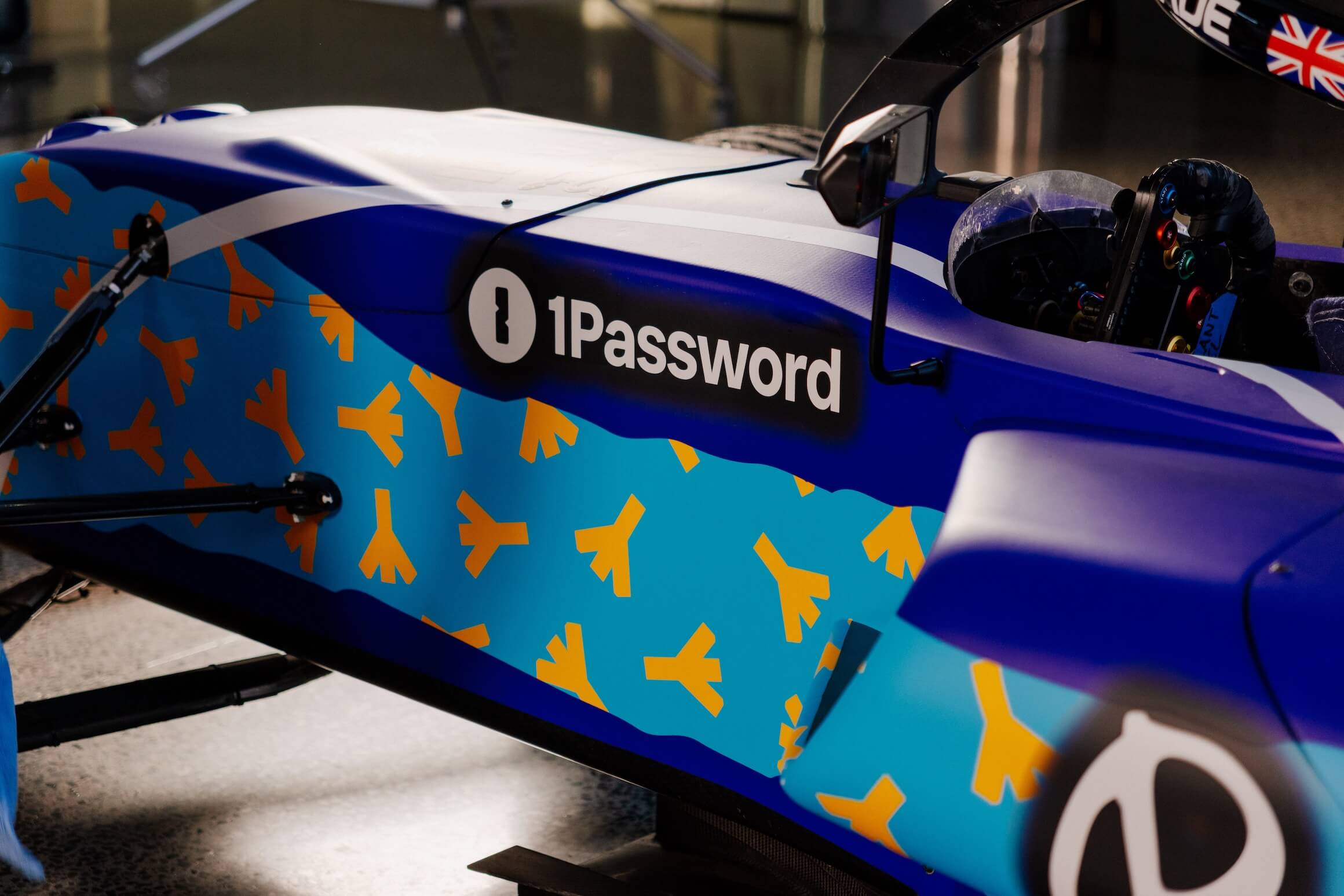 A photo of the side of the car with the dandelion seeds in motion.
