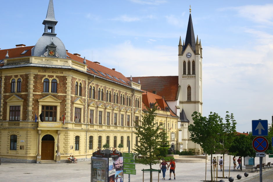 The main square of Keszthely is anchored by the 14th-century Gothic church, shown on the right. The walls behind the altar contain the remains of the biggest Gothic frescoes in all of Hungary. Photo: Tas Tóbiás