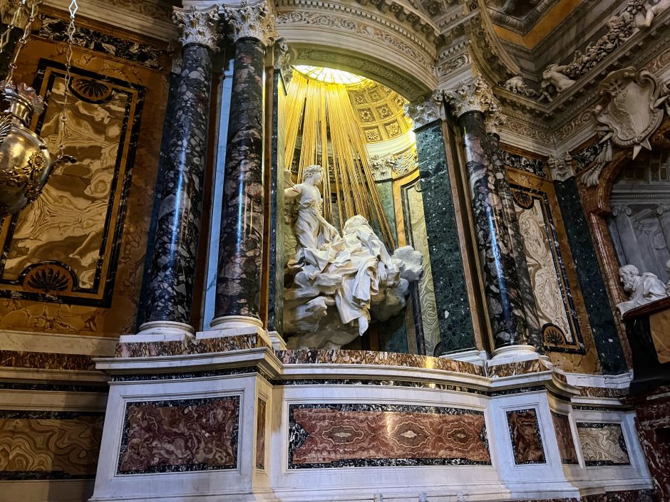 Bernini's Ecstasy of Saint Teresa (1652) inside the Santa Maria della Vittoria in Rome. It's easy to miss the exquisite details, such as the Coronaro family members kneeling on the sides and the beautiful marble fittings. Photo: Tas Tóbiás