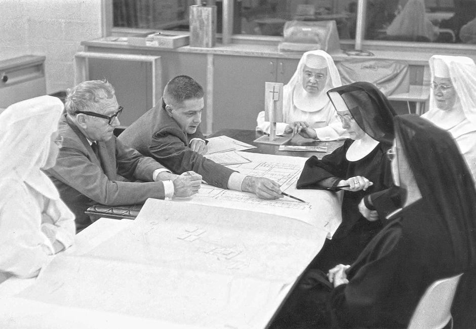 Breuer and his design partner Ham Smith discussing the plans of a monastery with Benedictine nuns in North Dakota. Clients often pointed out what a good listener Breuer was. Photo: Wikipedia / University of Mary Archives