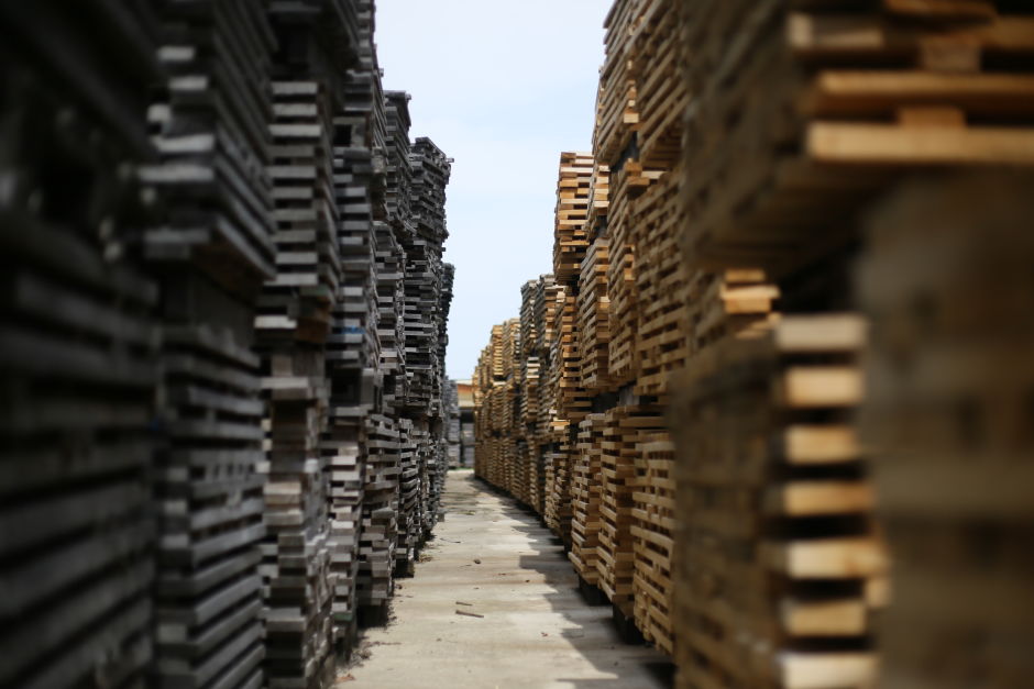 Piles of carefully arranged staves outside European Coopers' stave mill in Palotabozsok. During the years-long "seasoning" period, the astringency of the staves softens and new aroma molecules are created by enzymatic activity. Photo: Tas Tóbiás