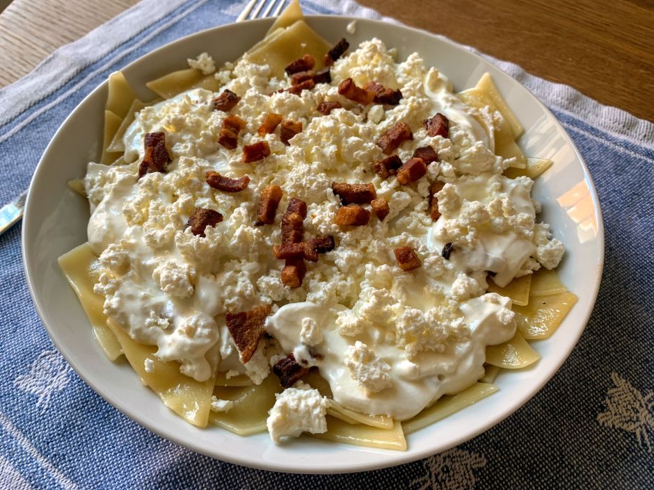 Túrós csusza, one of the oldest dishes in Hungary, consists of noodles layered with sour cream, túró, and pork cracklings. Photo: Tas Tóbiás