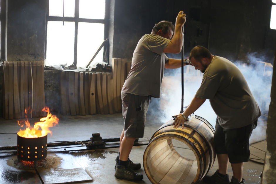 Two coopers at European Coopers are preparing to make an opening (bunghole) on the barrel. Photo: Tas Tóbiás  