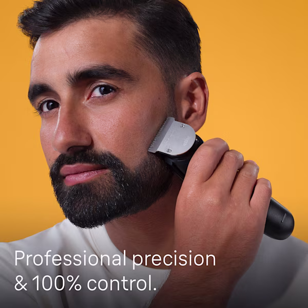 Man using Beard trimmer on beard Man using Beard trimmer on beard