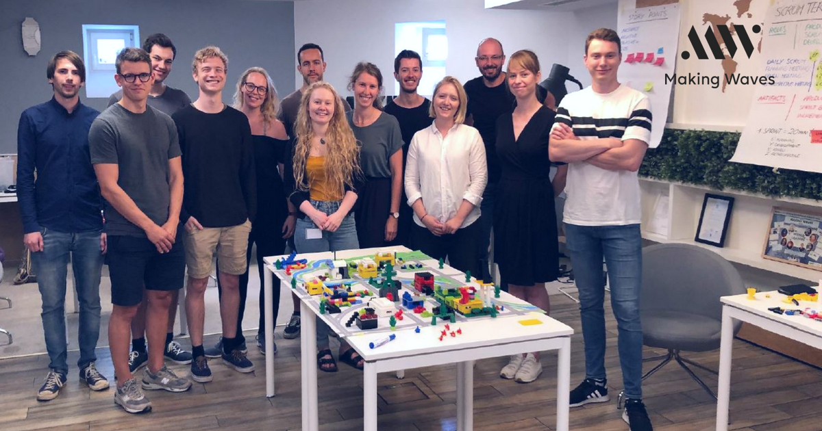 Group of employees posing after the Lego scrum workshop in Making Waves Poland.